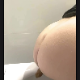 A girl records herself shitting while sitting on a toilet in 2 scenes. Audible plop sounds with clear poop action in the first scene. Presented in 720P vertical HD format. About a minute.